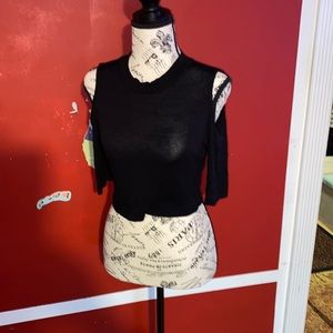 Black top ,shoulders out ,around the collar shirt